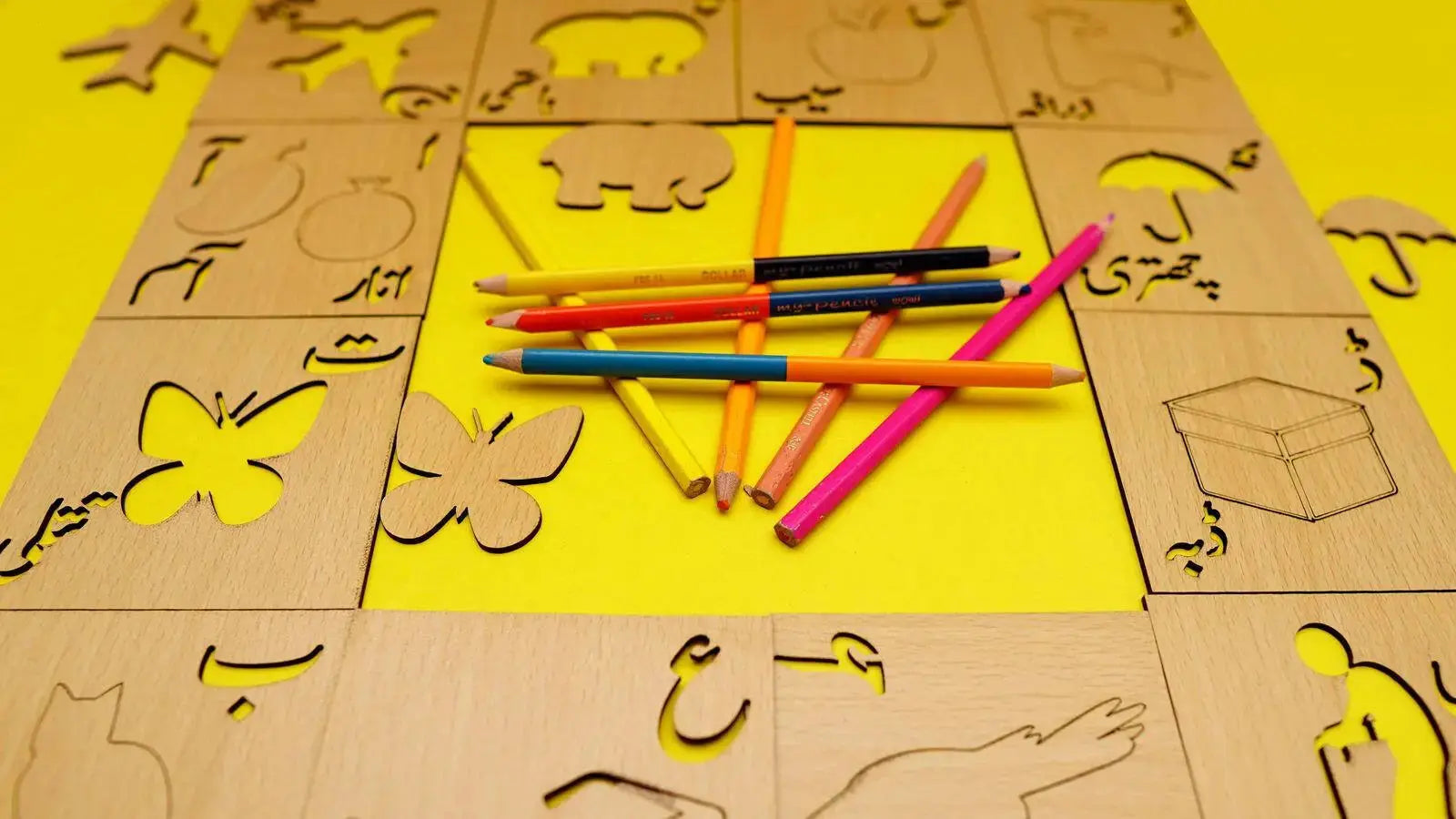 Close-Up of Wooden Urdu Alphabet Letters and Stencils- FB GAMEZ